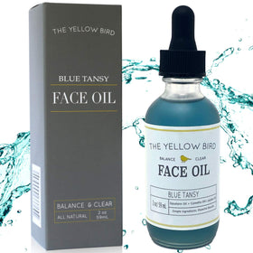 The Yellow Bird balancing blue tansy face oil bottle for lightweight hydration.