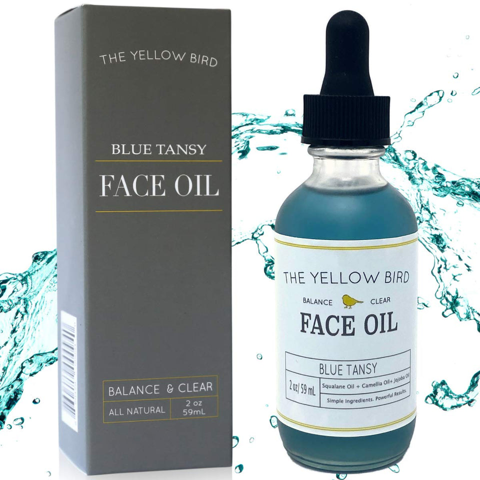 The Yellow Bird balancing blue tansy face oil bottle for lightweight hydration.