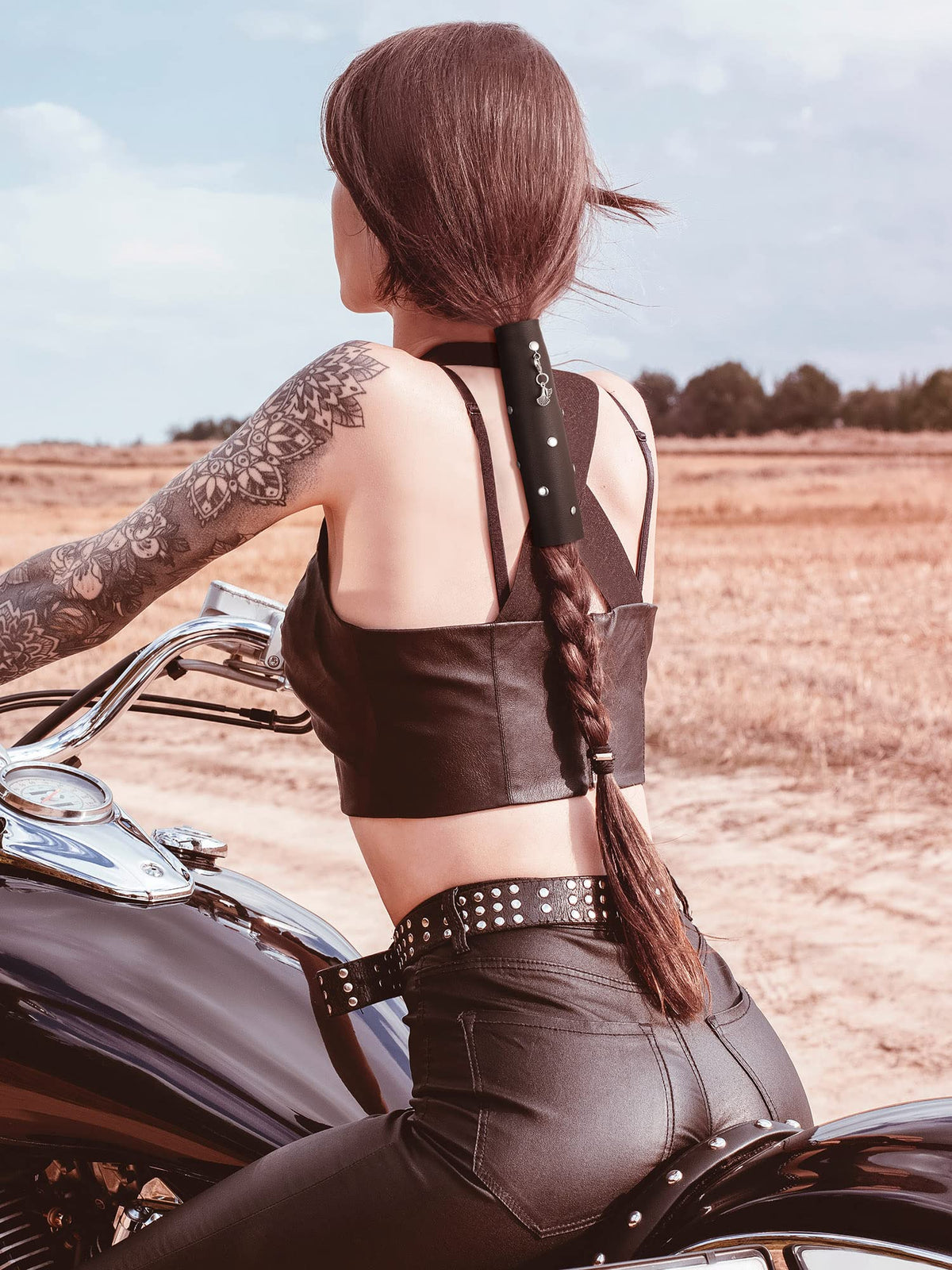 Close-up of Yinkin leather hair wrap showing stainless steel hook for secure closure