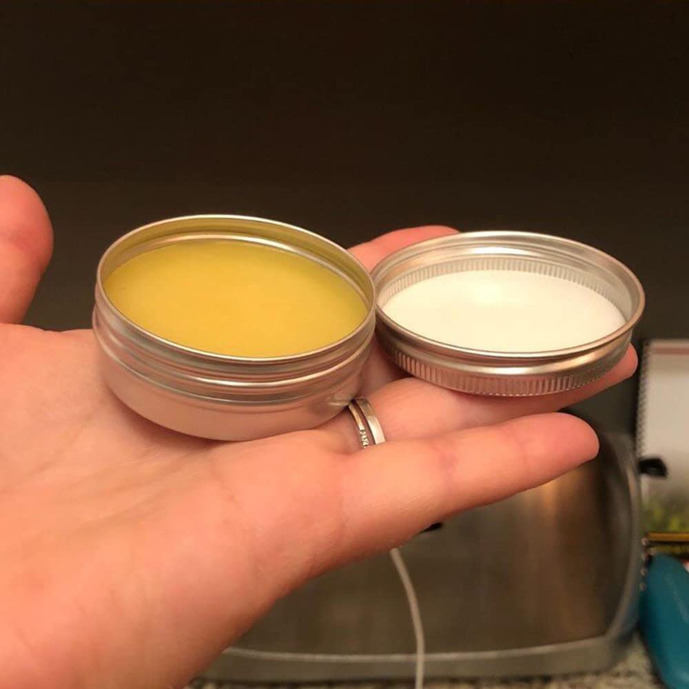 Silver round tin by Ymkf Sqqr, versatile for candles, salves, and teas.