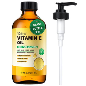 Yoken Vitamin E Oil in an amber glass bottle protects freshness and purity.