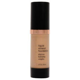 The Youngblood Liquid Mineral Foundation Sun Kissed bottle with a dewy finish.