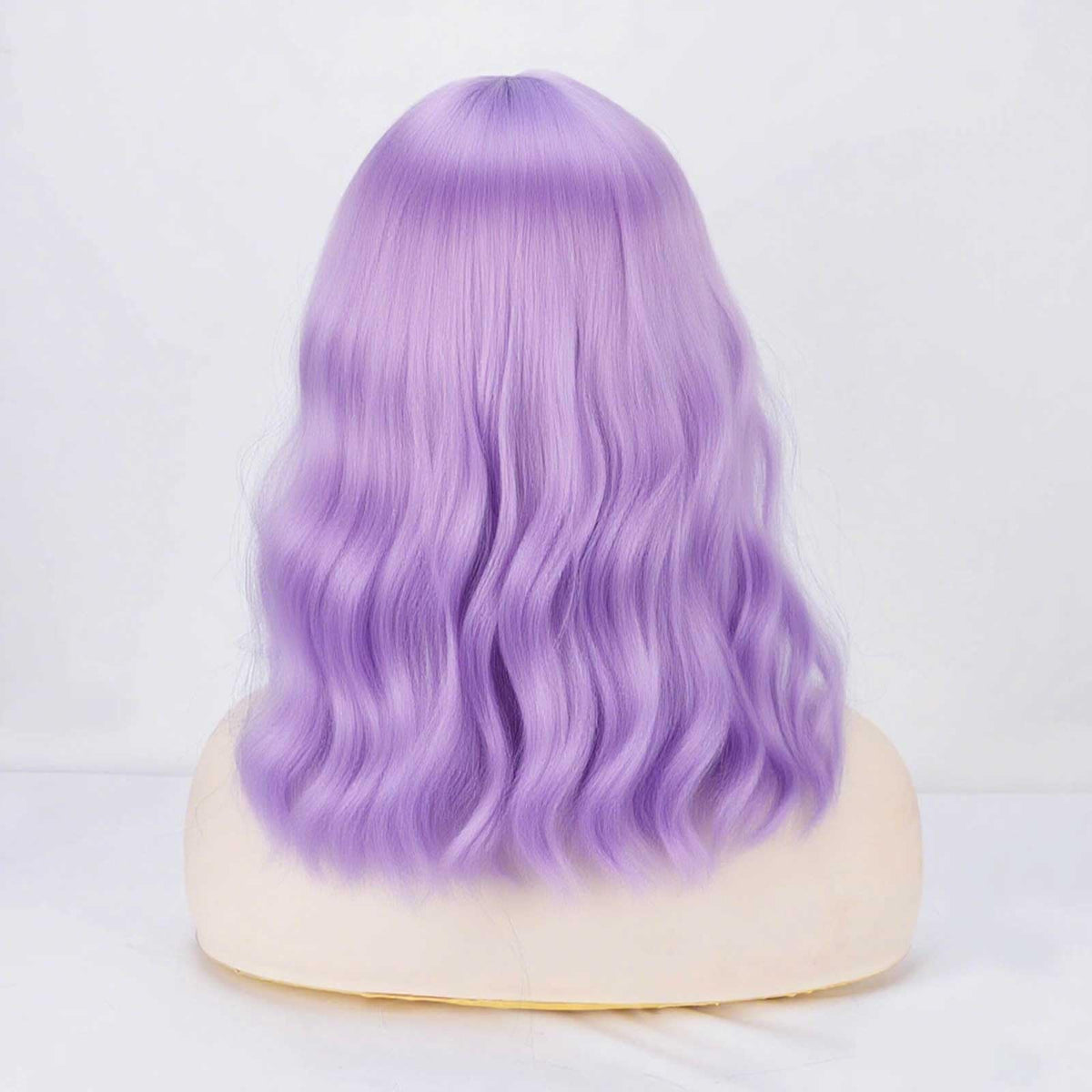 YOUNIGA shoulder-length waves frame the face for versatile styling.