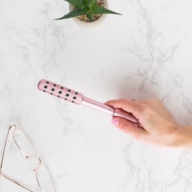 YOUTHLUX Radiance Roller rose-gold portable tool for travel self-care.