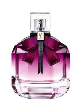 YSL Mon Paris Intense bottle on a reflective surface for elegant evening wear.