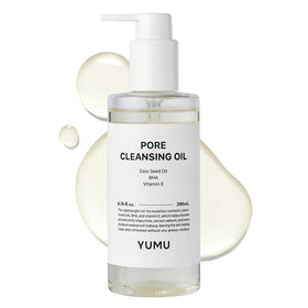 YUMU Coix Seed Deep Pore Cleansing Oil bottle pour for easy makeup removal.