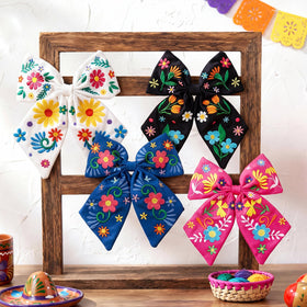 Yunlly flower bows with Mexican embroidery add festive flair to any hairstyle.