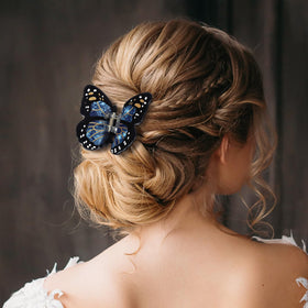 Yuxung Monarch butterfly hair clip worn in hair for chic everyday look