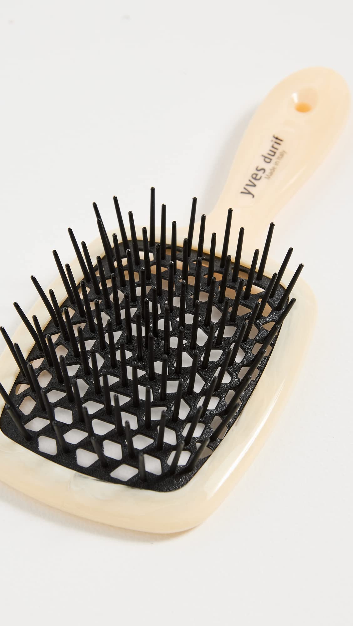 Close-up of Yves Durif brush showing carbon fiber core and ergonomic grip