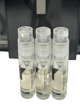 Close-up of YSL logo on vial cap with premium branding.