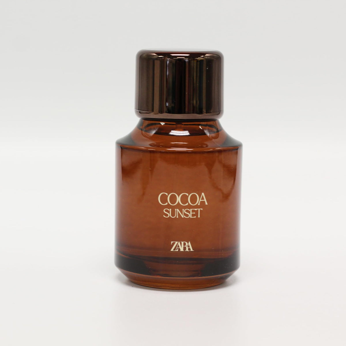 Close-up of creamy texture on Zara Cocoa Sunset bottle