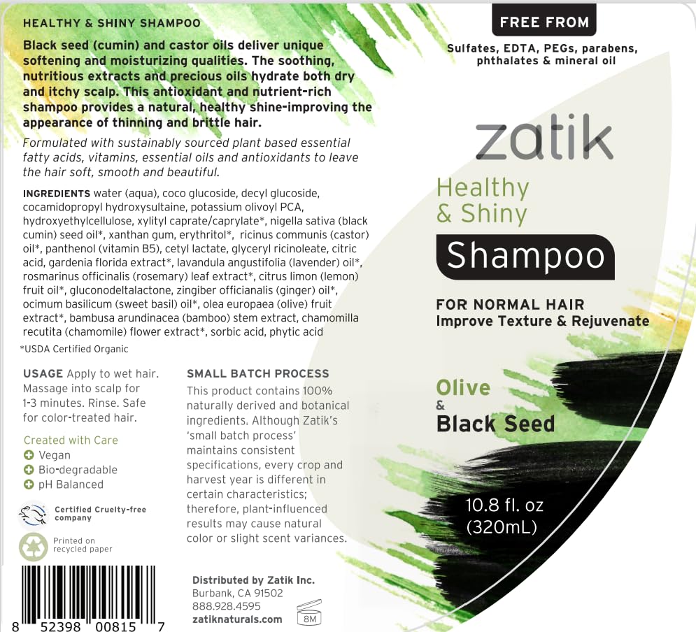 Zatik bottle close-up showing rich lather on wet hair.