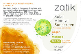 Zatik sunscreen label close-up, vegan and gluten-free formula.