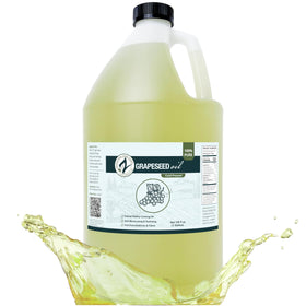 Zatural grapeseed oil bottle pour shows light green-gold sheen ideal for high-heat cooking.