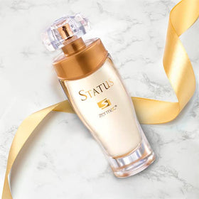 Zermat Status wearer applying perfume at work or event