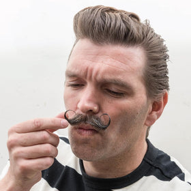 ZEUS Mustache Wax styled mustache on display for polished, long-lasting results.