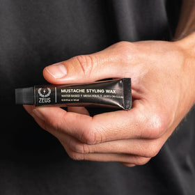 ZEUS Mustache Wax travel-size tube highlights compact design for on-the-go grooming.