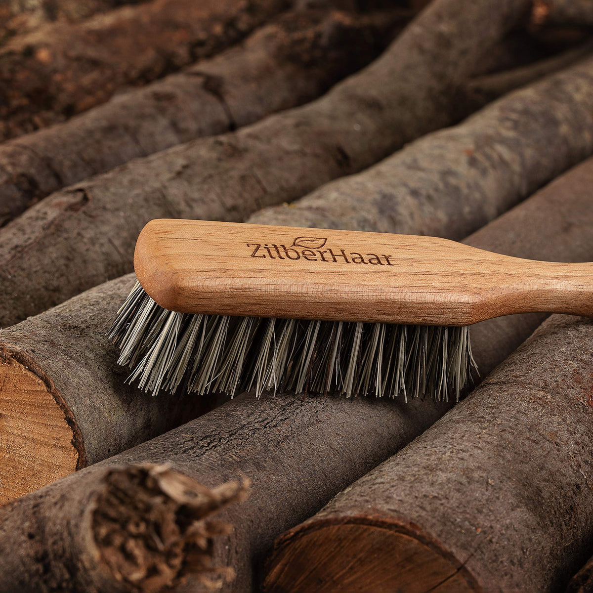 ZilberHaar vegan beard brush walnut handle for comfortable control.