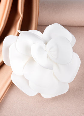 Zinniday bridal fascinator with rose accent complements gowns and tea-length dresses