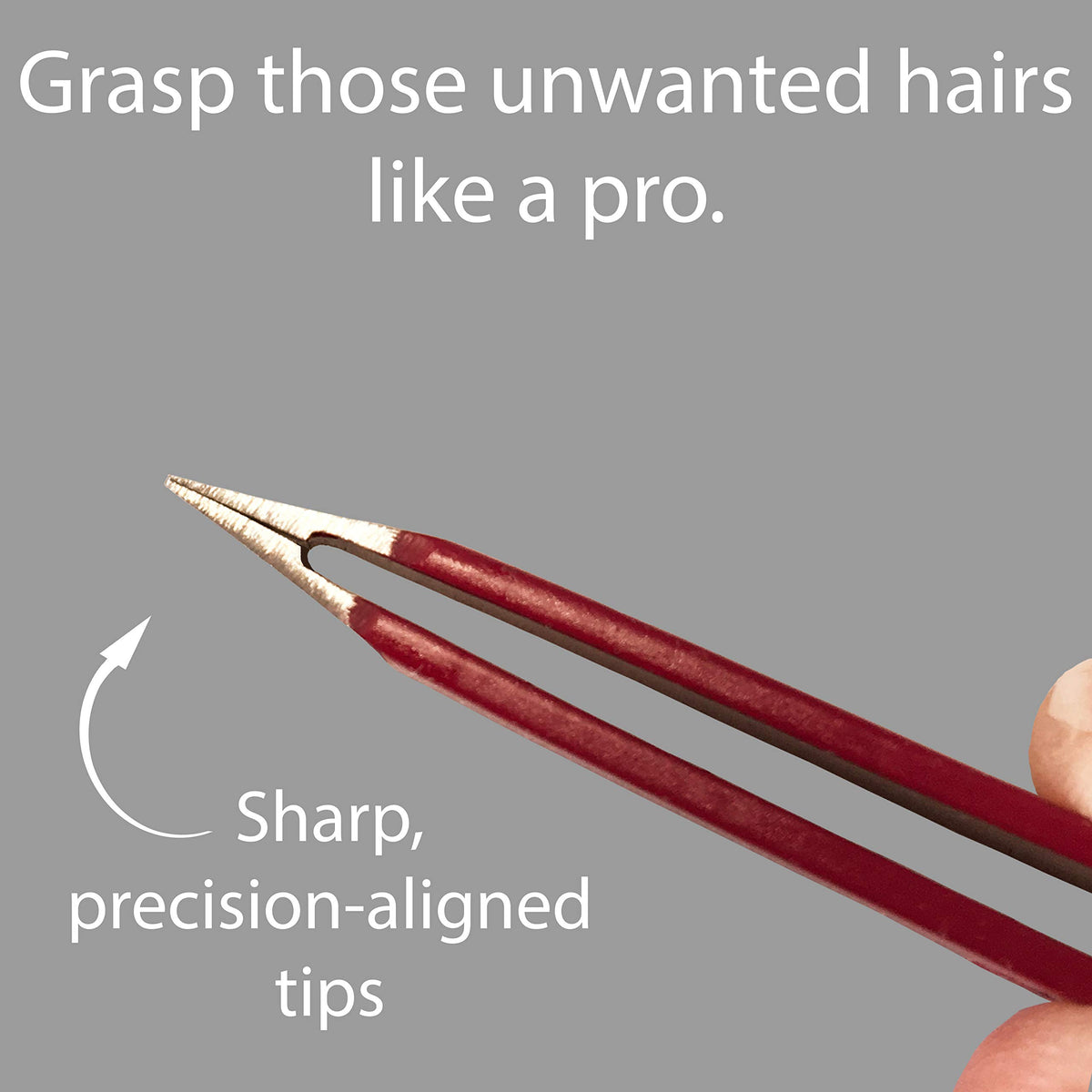 Zizzili Basics tweezers shown for eyebrow shaping in ruby red.