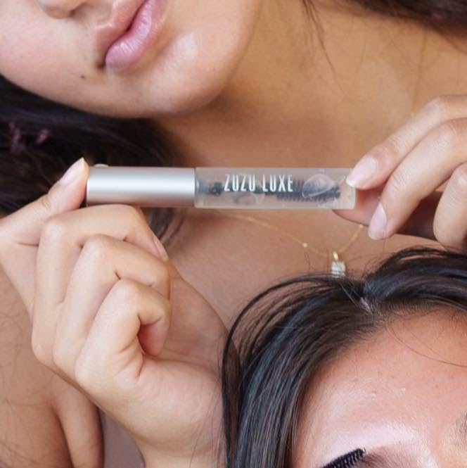 Zuzu Luxe Clear Mascara lash brush stroke demonstrating precise, buildable gloss.