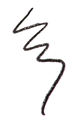 Zuzu Luxe Obsidian-Black pencil-tip close-up showing smooth glide.